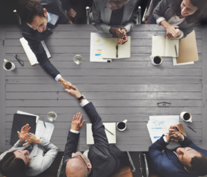 Business professionals sitting around a table