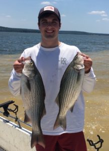 Scott Courtney holding two fish