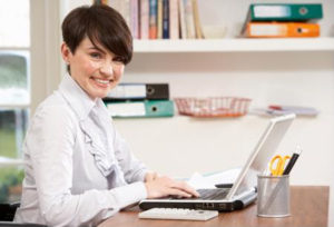 Women typing on computer